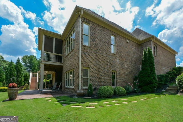 4880 Cecilia Sq, Cumming, GA 30040 - rear view of property with stairway, a patio, brick siding, and a yard