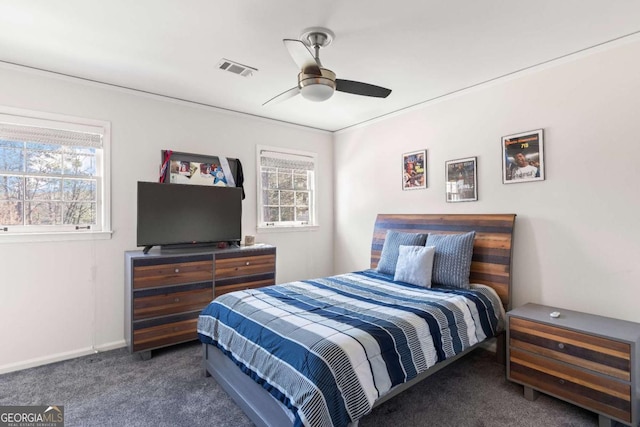 bedroom with baseboards, carpet floors, visible vents, and a ceiling fan