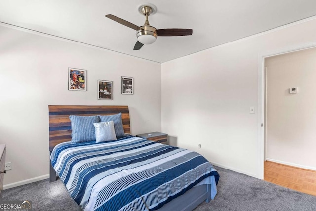 bedroom featuring ceiling fan and baseboards