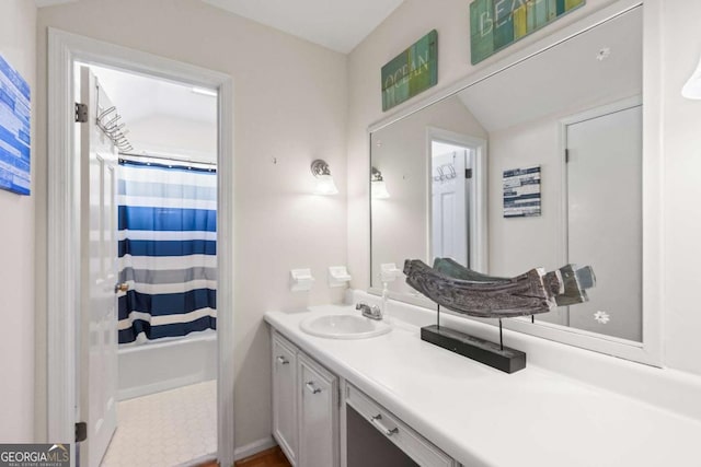 bathroom featuring vanity and shower / tub combo with curtain