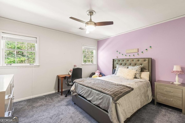 bedroom featuring carpet floors, baseboards, visible vents, and a ceiling fan