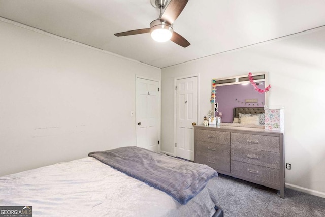 bedroom with ceiling fan, carpet flooring, and baseboards