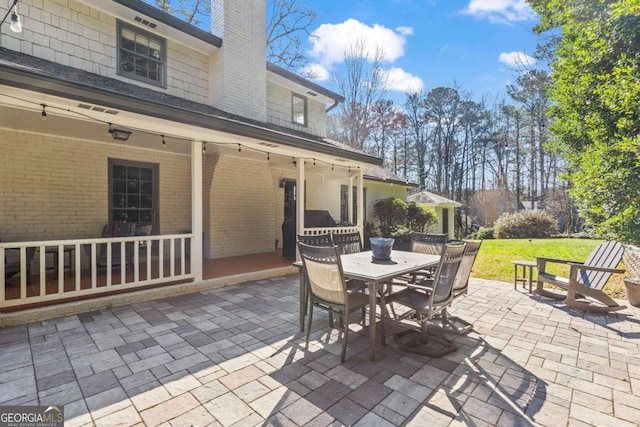 view of patio featuring outdoor dining space