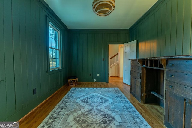 bedroom featuring baseboards and light wood finished floors