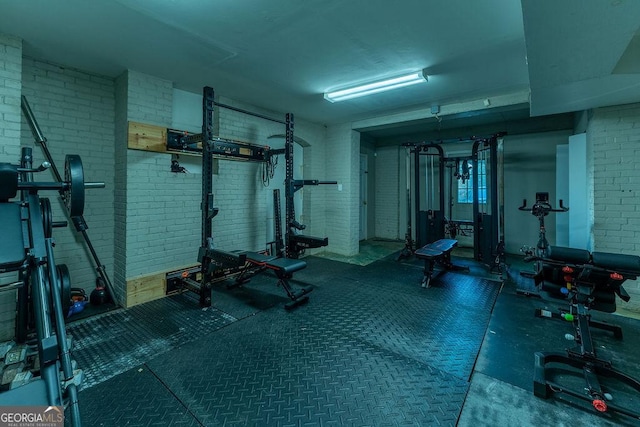 workout area with brick wall