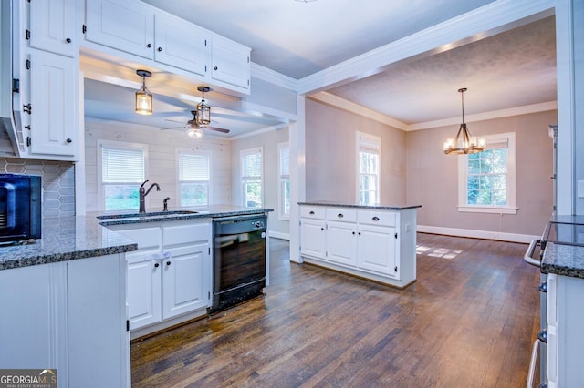 kitchen featuring white cabinets, dark wood finished floors, and a peninsula