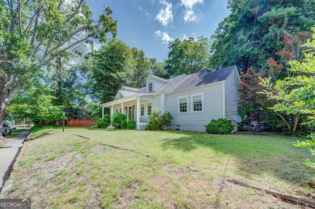 cape cod home with crawl space, covered porch, and a front yard