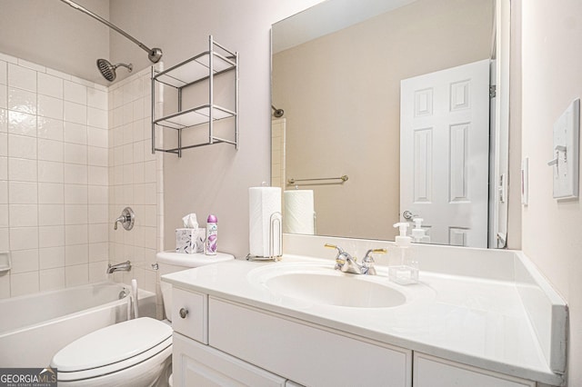 bathroom with  shower combination, vanity, and toilet