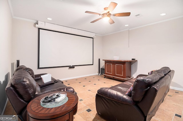 home theater with ceiling fan, ornamental molding, visible vents, and baseboards