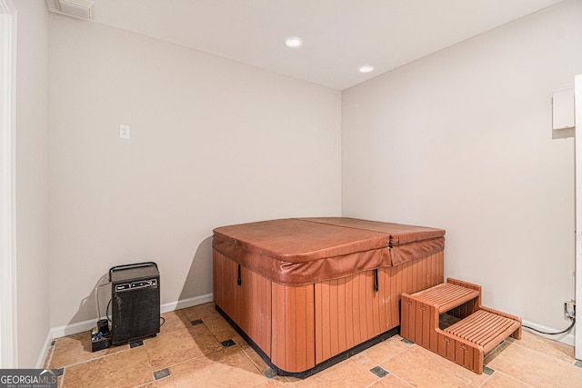 miscellaneous room featuring baseboards, visible vents, and recessed lighting