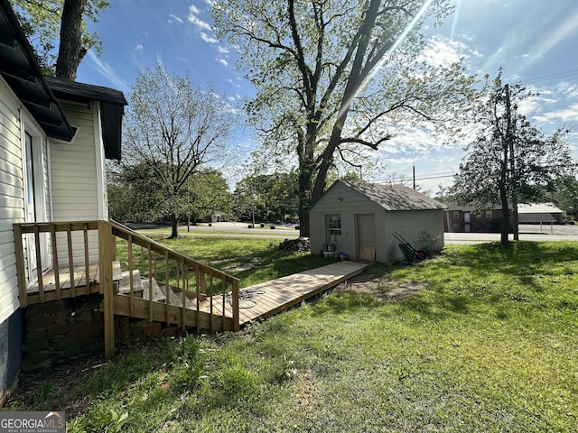 view of yard with an outbuilding and a detached garage