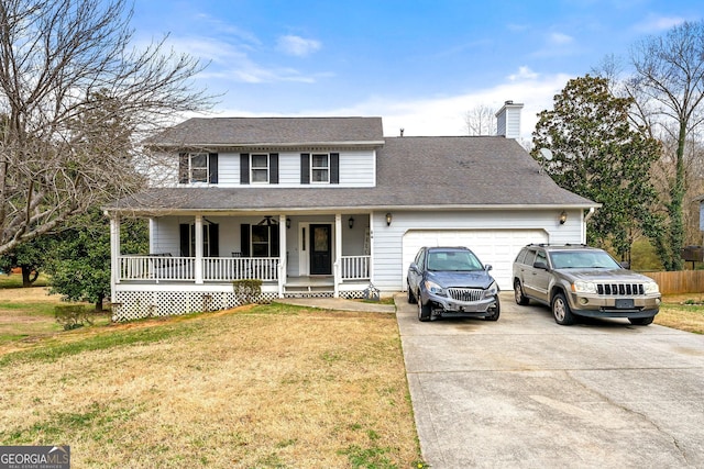 traditional home with a chimney, a porch, concrete driveway, an attached garage, and a front yard