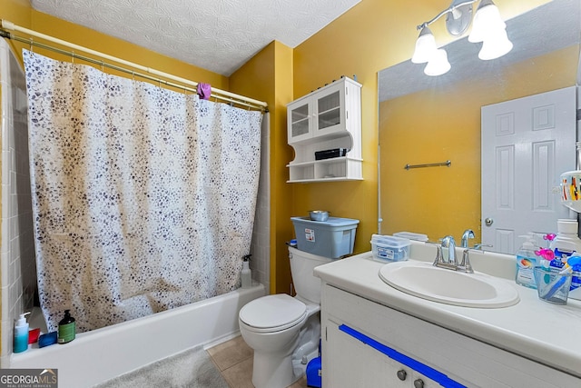 bathroom featuring a textured ceiling, tile patterned flooring, toilet, vanity, and shower / bath combo