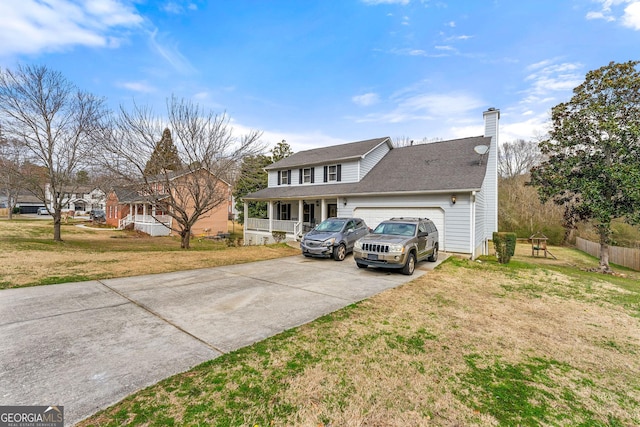 view of front of home featuring a front lawn, driveway, a chimney, and an attached garage