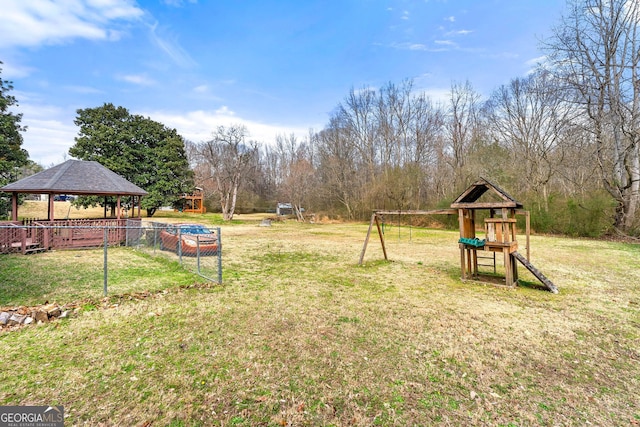 view of yard with a playground and a gazebo