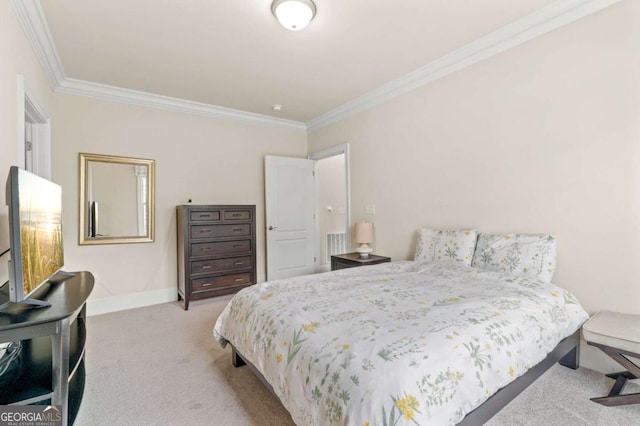 carpeted bedroom featuring crown molding and baseboards