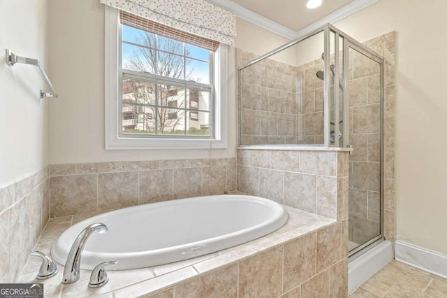 full bathroom featuring a bath, a shower stall, and crown molding