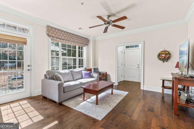 living area featuring crown molding, visible vents, baseboards, and dark wood-type flooring