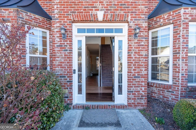 entrance to property with brick siding