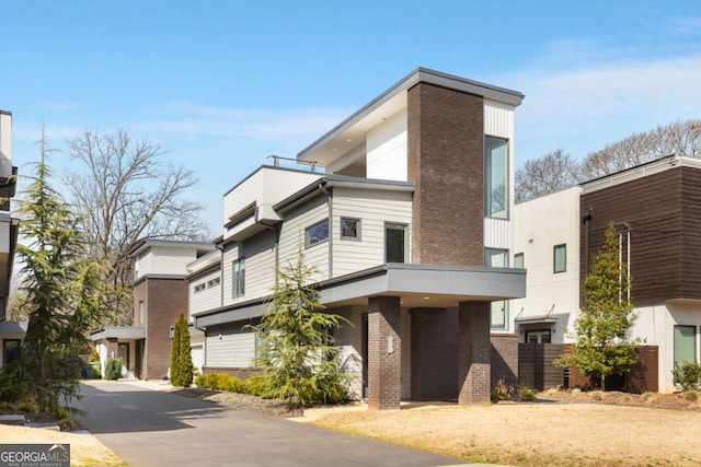 view of front of home featuring brick siding