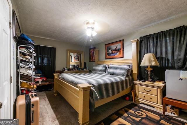 carpeted bedroom with a textured ceiling