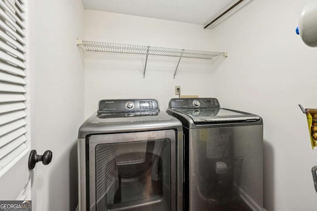 laundry room featuring laundry area and washer and clothes dryer