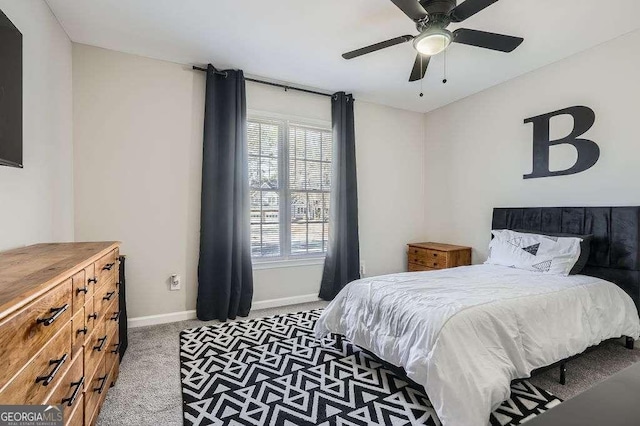 bedroom featuring ceiling fan, carpet floors, and baseboards