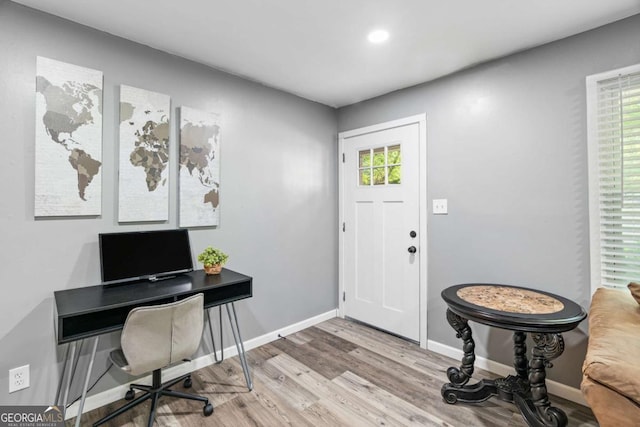 entryway featuring recessed lighting, wood finished floors, and baseboards