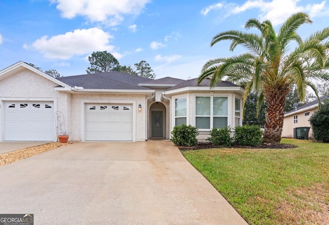 ranch-style home with driveway, roof with shingles, an attached garage, a front lawn, and stucco siding