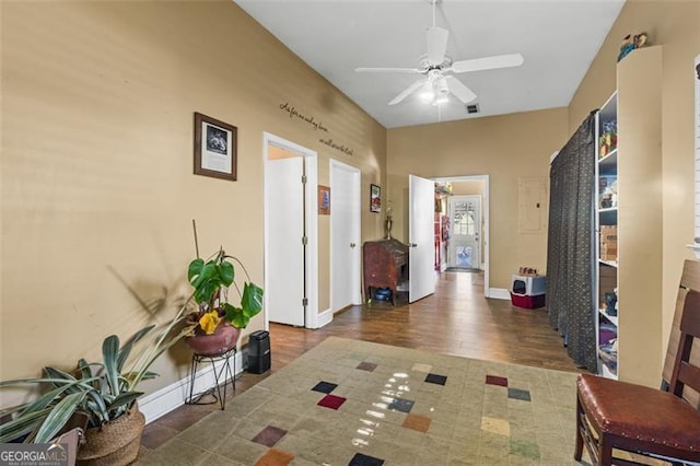 entrance foyer with a ceiling fan, visible vents, and baseboards