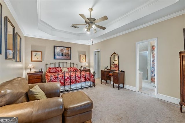 bedroom with crown molding, a tray ceiling, visible vents, and light colored carpet