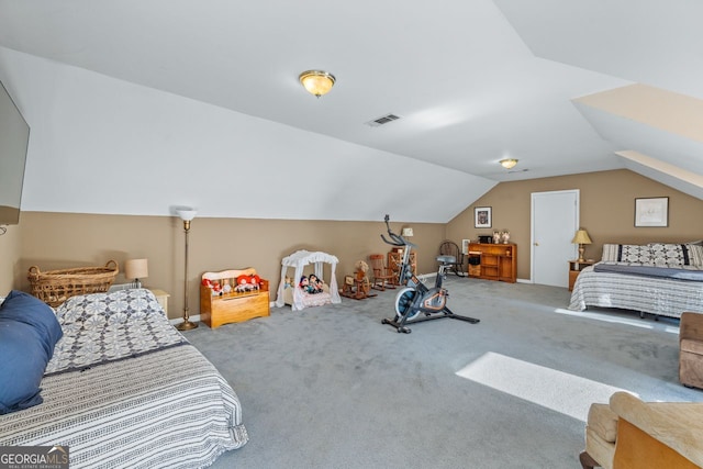 bedroom with lofted ceiling, visible vents, and carpet