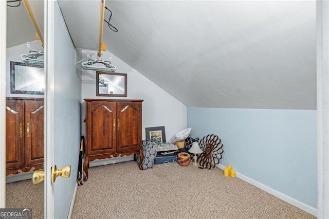 bonus room featuring vaulted ceiling, carpet, and baseboards