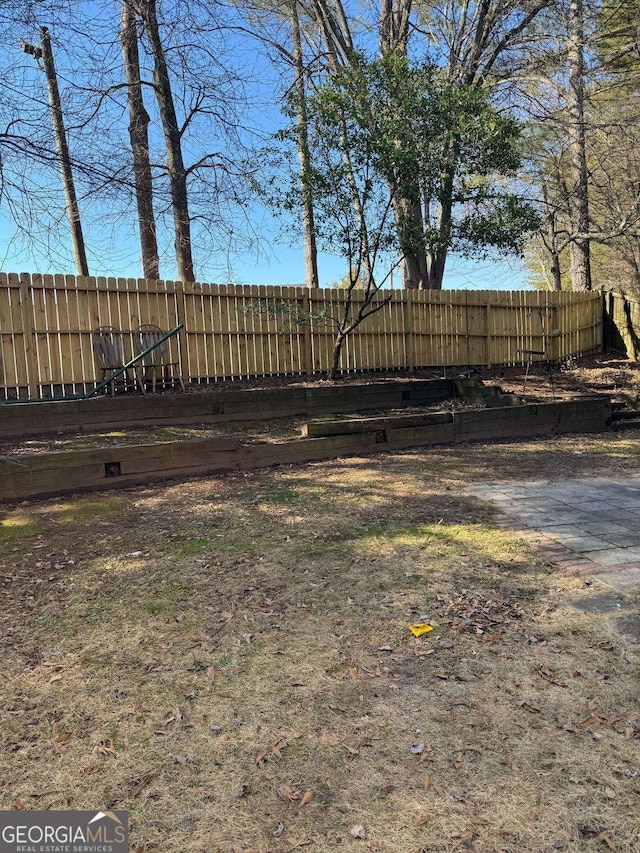 view of yard with a fenced backyard