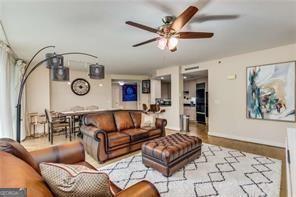 living area featuring ceiling fan