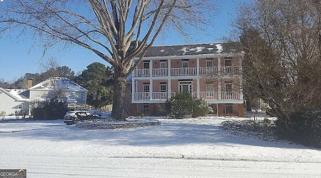 view of front of house with a balcony