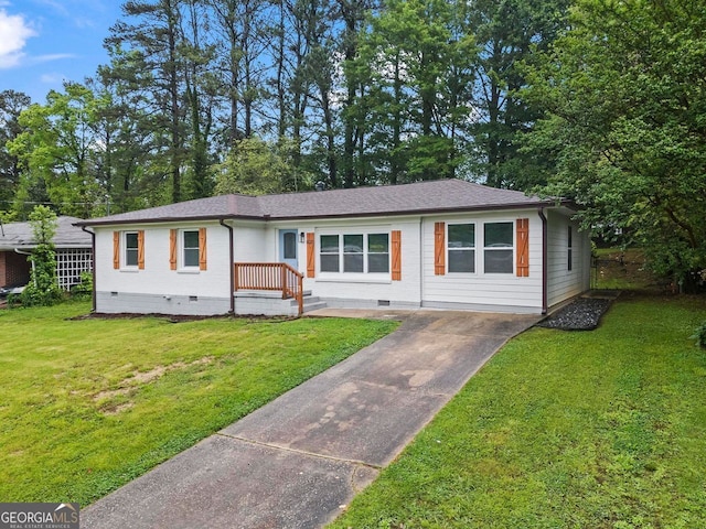 view of front of home with concrete driveway, crawl space, and a front yard