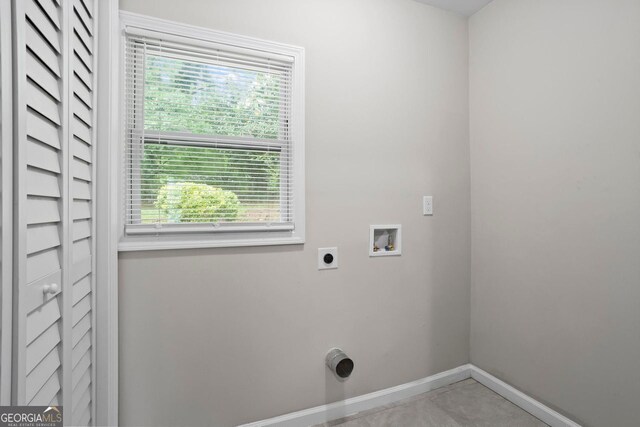 clothes washing area with laundry area, washer hookup, a healthy amount of sunlight, and electric dryer hookup
