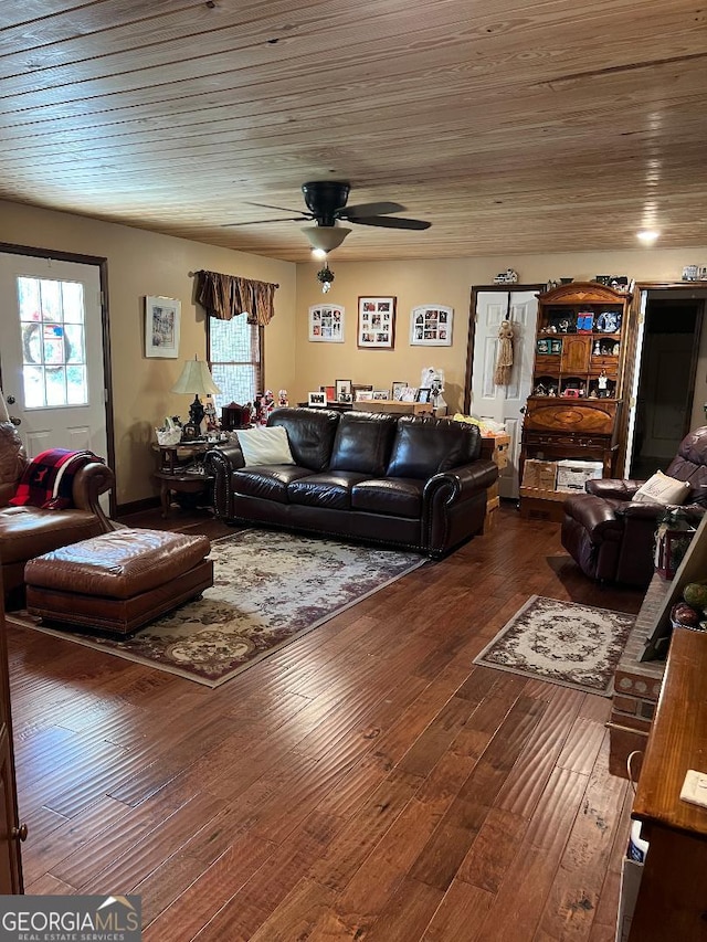 living room with ceiling fan, hardwood / wood-style floors, and wooden ceiling