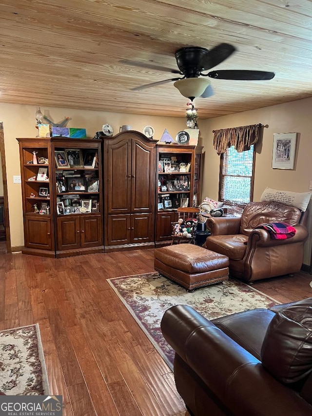 living area with wooden ceiling, hardwood / wood-style flooring, and a ceiling fan