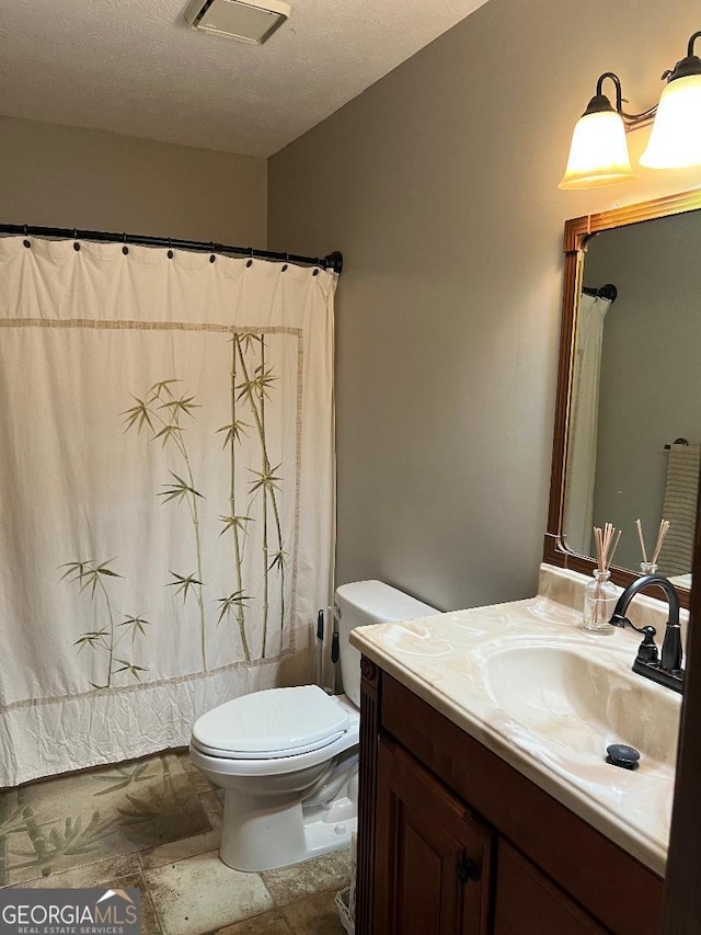 full bath featuring visible vents, toilet, shower / bathtub combination with curtain, a textured ceiling, and vanity