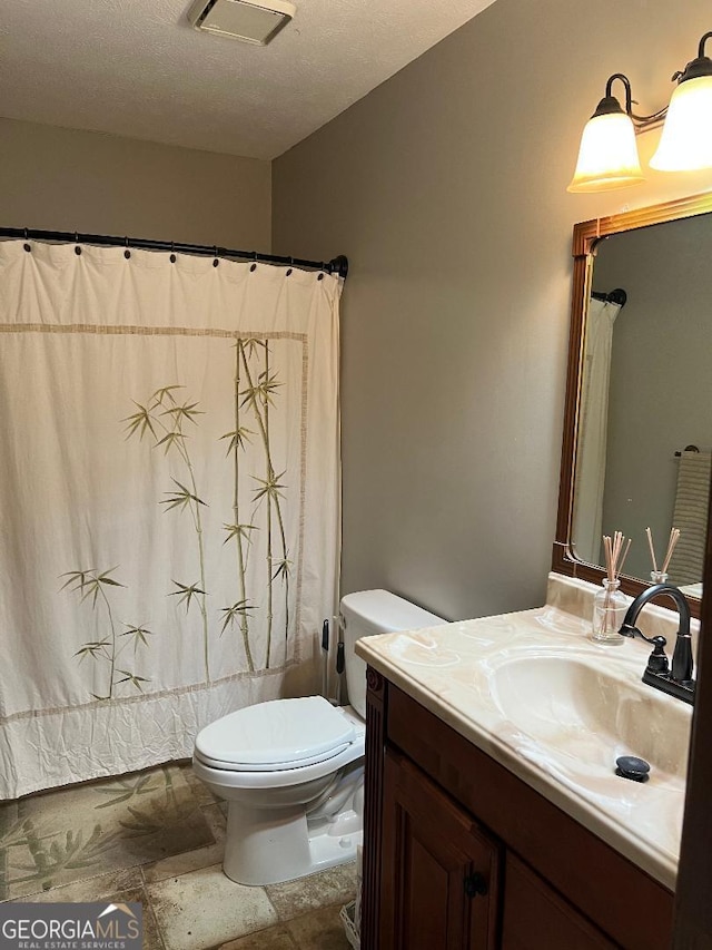219 Loblolly Dr, Swainsboro, GA 30401 - full bath with shower / bath combo, a textured ceiling, visible vents, toilet, and vanity