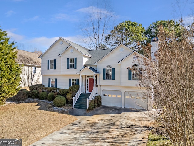 tri-level home featuring driveway and an attached garage