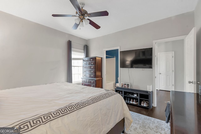 bedroom with ceiling fan and dark wood-type flooring