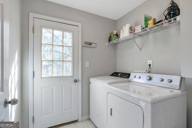 washroom featuring laundry area and washing machine and dryer