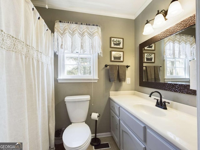 full bathroom with plenty of natural light, crown molding, vanity, and toilet