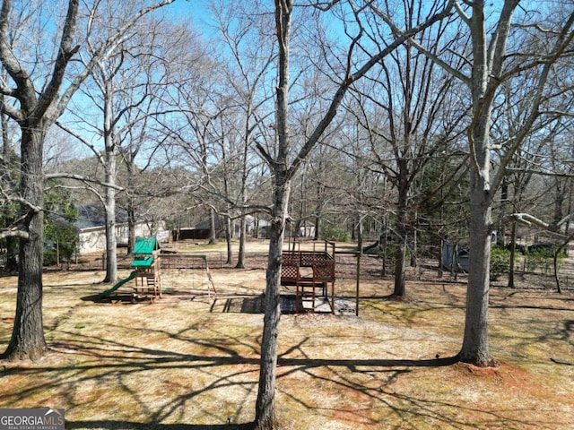 view of yard featuring playground community