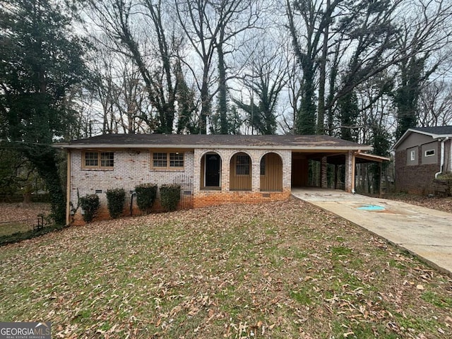 ranch-style home featuring concrete driveway, an attached carport, crawl space, fence, and brick siding