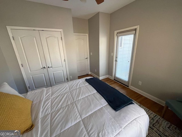 bedroom featuring ceiling fan, a closet, baseboards, and wood finished floors