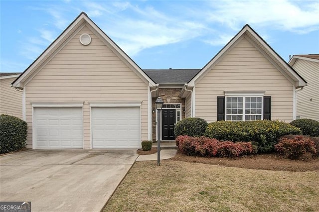 single story home featuring a garage, concrete driveway, and stone siding